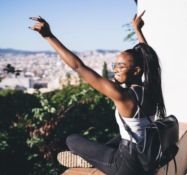Solo female traveler enjoying freedom and discovering the city
